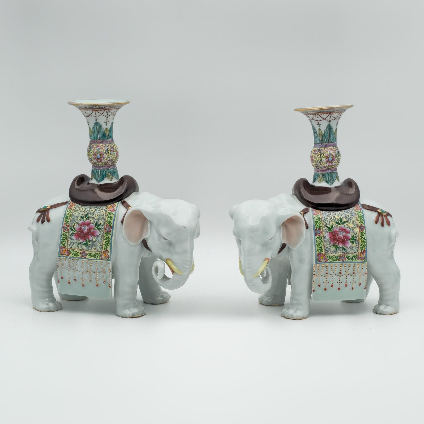 A PAIR OF CHINESE FAMILLE ROSE ELEPHANT-FORM JOSS STICK HOLDERS | REPUBLIC PERIOD, 20TH CENTURY