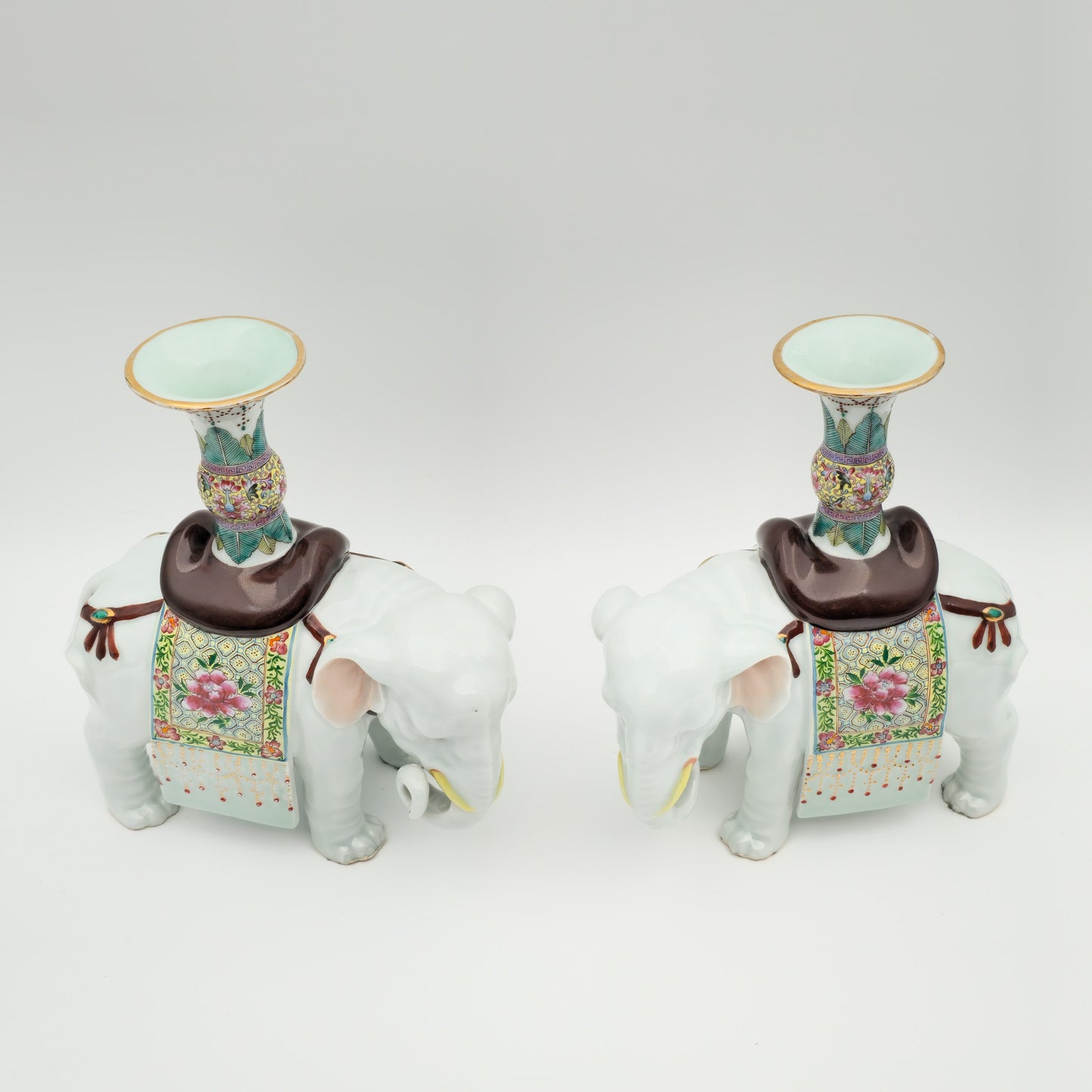 A PAIR OF CHINESE FAMILLE ROSE ELEPHANT-FORM JOSS STICK HOLDERS | REPUBLIC PERIOD, 20TH CENTURY