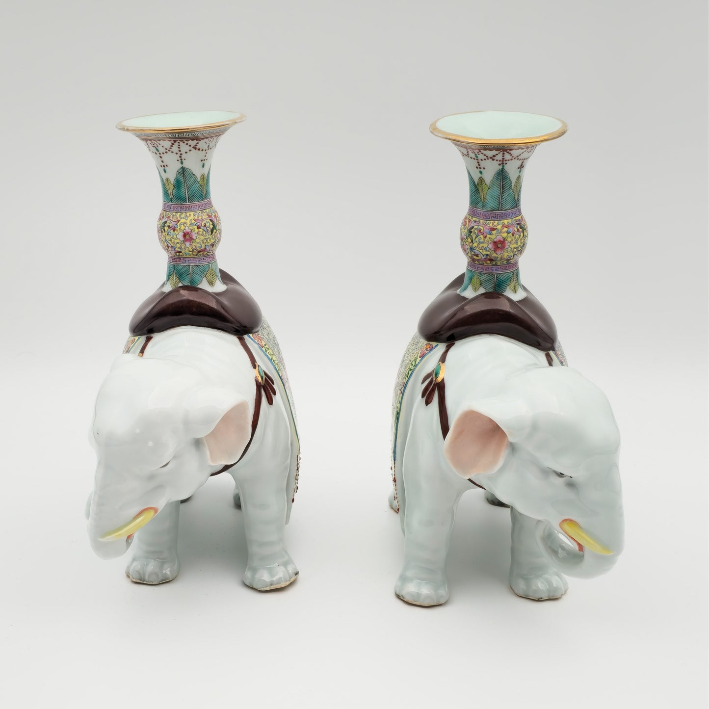 A PAIR OF CHINESE FAMILLE ROSE ELEPHANT-FORM JOSS STICK HOLDERS | REPUBLIC PERIOD, 20TH CENTURY