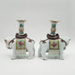 A PAIR OF CHINESE FAMILLE ROSE ELEPHANT-FORM JOSS STICK HOLDERS | REPUBLIC PERIOD, 20TH CENTURY