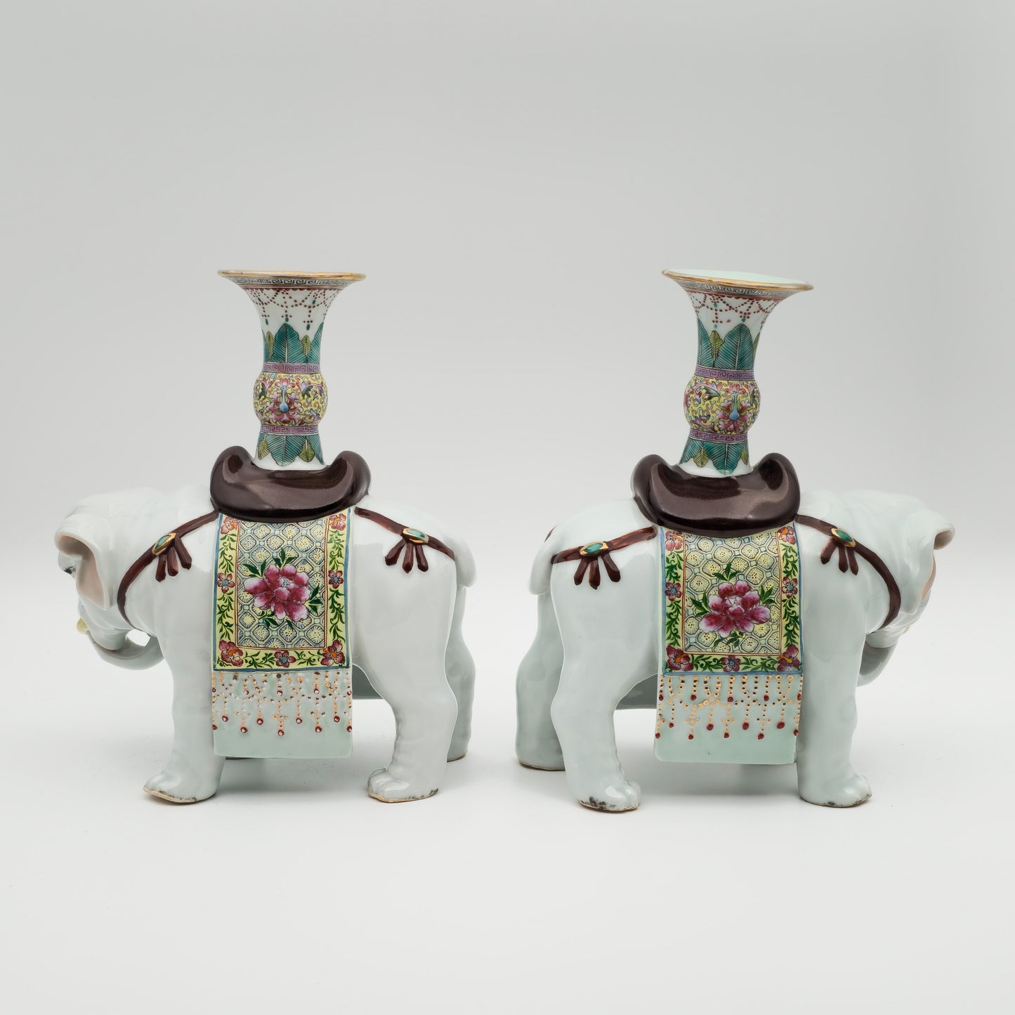 A PAIR OF CHINESE FAMILLE ROSE ELEPHANT-FORM JOSS STICK HOLDERS | REPUBLIC PERIOD, 20TH CENTURY