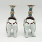 A PAIR OF CHINESE FAMILLE ROSE ELEPHANT-FORM JOSS STICK HOLDERS | REPUBLIC PERIOD, 20TH CENTURY