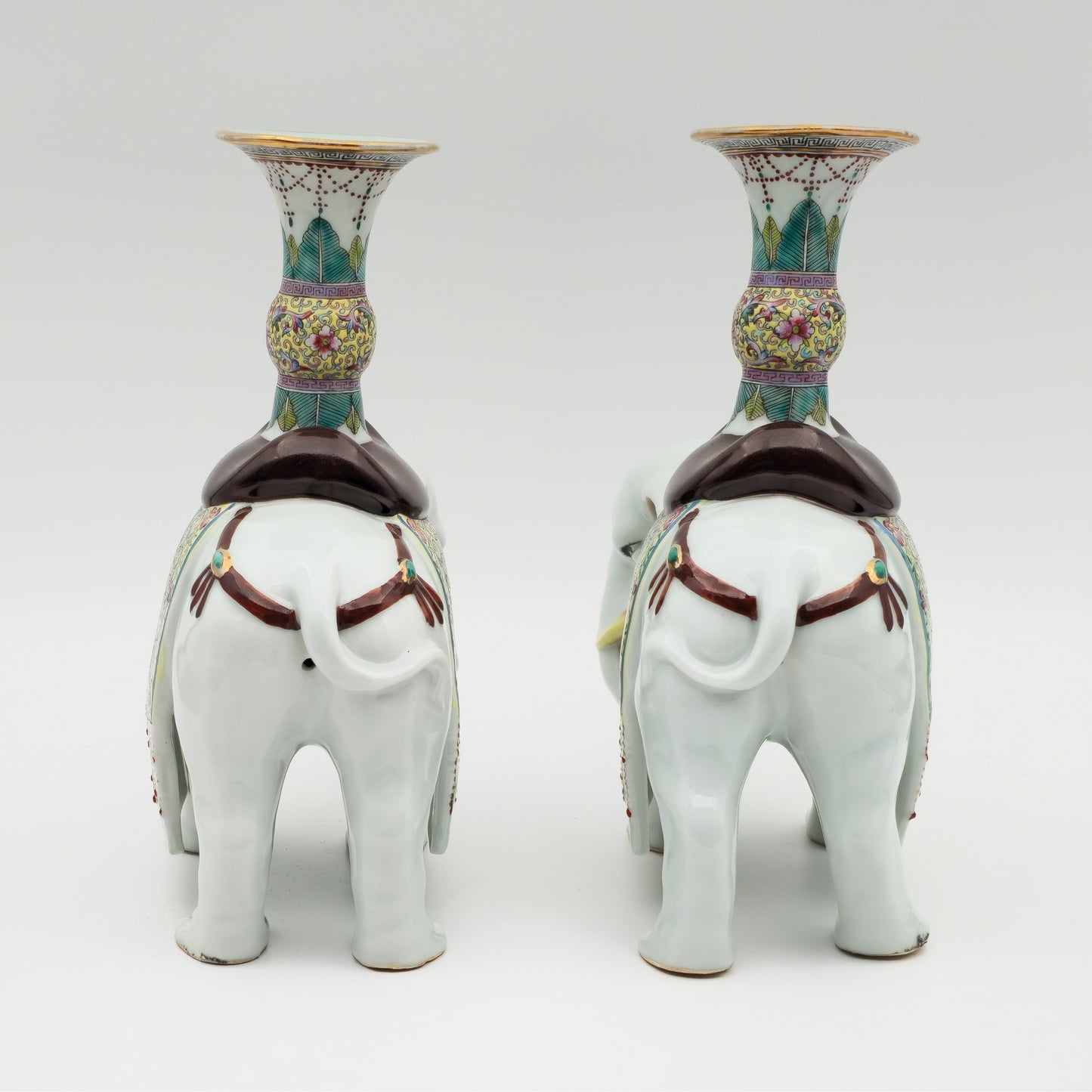 A PAIR OF CHINESE FAMILLE ROSE ELEPHANT-FORM JOSS STICK HOLDERS | REPUBLIC PERIOD, 20TH CENTURY