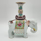 A PAIR OF CHINESE FAMILLE ROSE ELEPHANT-FORM JOSS STICK HOLDERS | REPUBLIC PERIOD, 20TH CENTURY