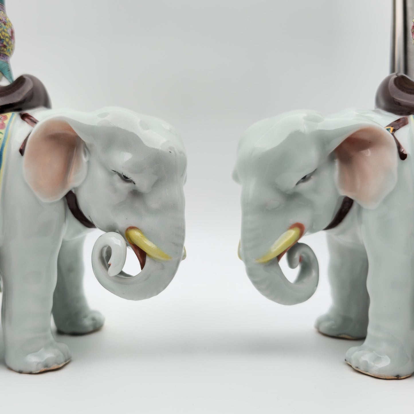 A PAIR OF CHINESE FAMILLE ROSE ELEPHANT-FORM JOSS STICK HOLDERS | REPUBLIC PERIOD, 20TH CENTURY